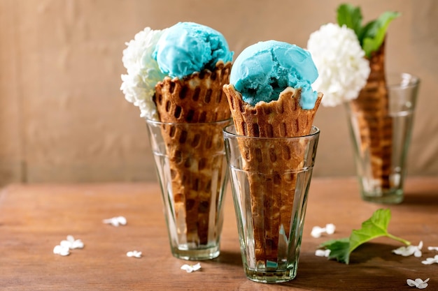 Turquoise ice cream in waffle cones