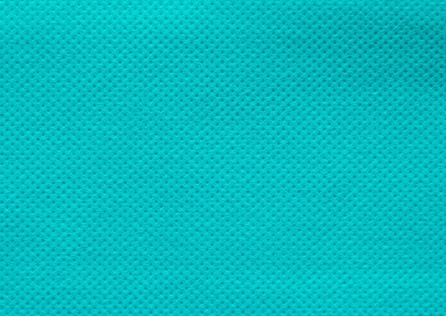 Turquoise nonwoven fabric texture backgroundxA