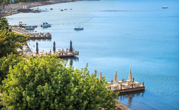 Turquoise sea and piers with cafe tables Marmaris Turkey