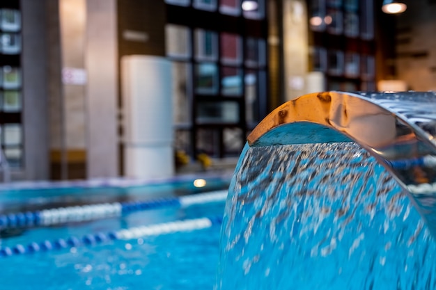 A turquoise waterfall, back and shoulder massage in the pool