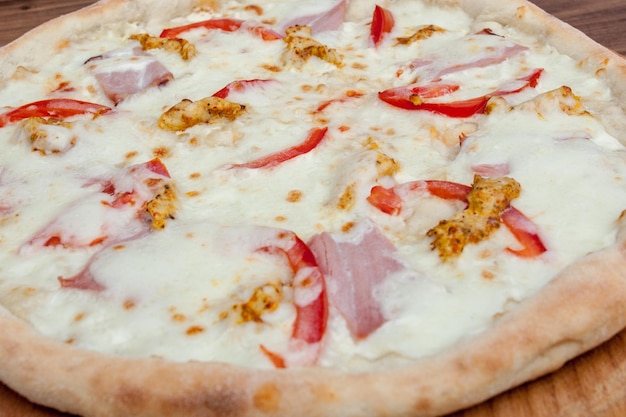 Tuscan Classic Pizza on the wooden table top view Vegetarian food