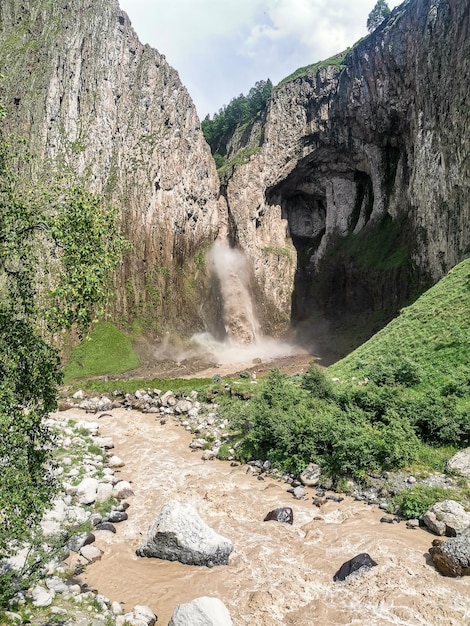 TuzlukShapa Waterfall surrounded by the Caucasus Mountains near Elbrus Jilysu Russia