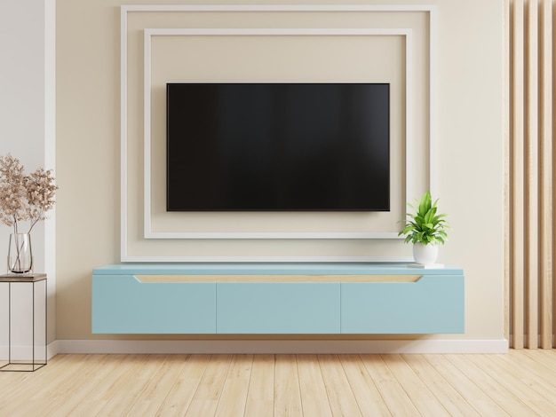 TV on the blue cabinet in modern living room on cream color wall background,3d rendering