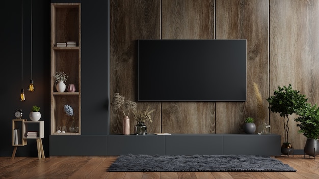 TV wall mounted in a dark room with a dark wood wall.3d rendering