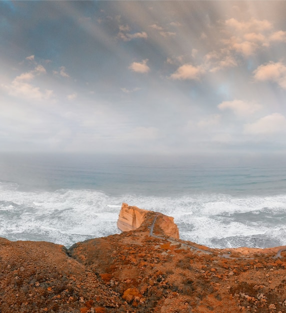 The Twelve Apostles at sunrise, Victoria, Australia. Panoramic aerial view on a cloudy morning.