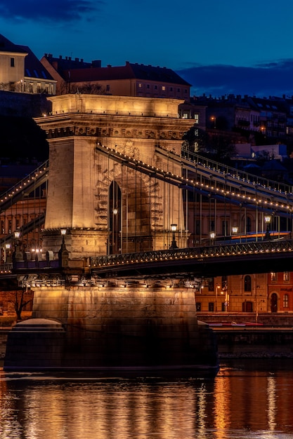 Twilight in Budapest, the Chain Bridge over the Danube, the reflection of night lights on the water