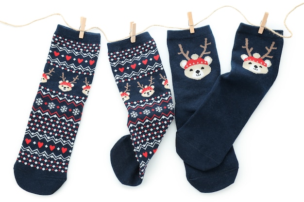 Twine with Christmas socks isolated on white background