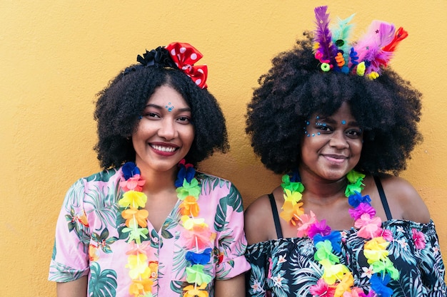 Two Afro women celebrating street carnival