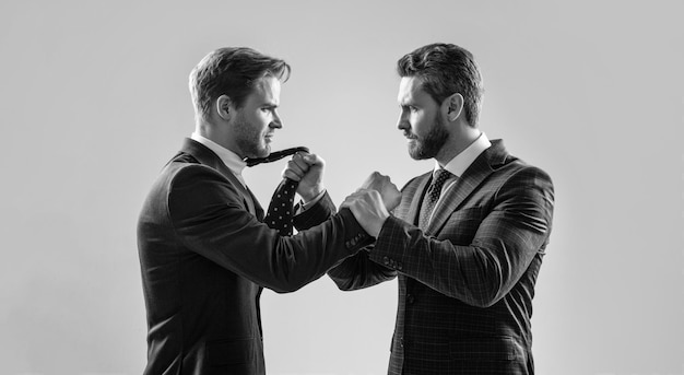 Photo two angry businessmen fighting and arguing on businessmeeting have business competition leadership