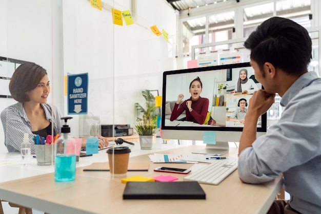 Two asian businessperson work from home office involved video conference meeting