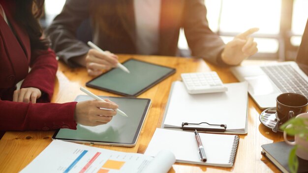 Two of asian businesswomen discussing an interesting business idea and planning business model in modern office