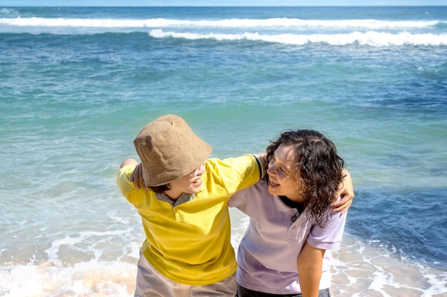 Two Asian women with an excited expression traveling on the beach