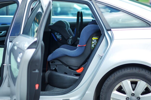 two baby safety seat placing it in the car