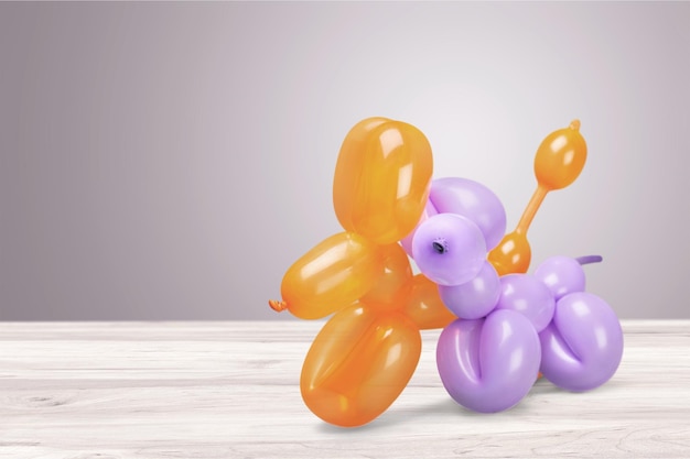 Two balloons in shape of animals on