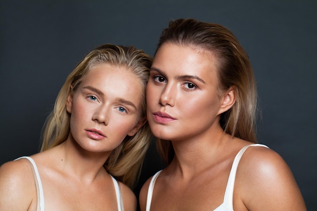 Two beautiful female face Women with natural makeup