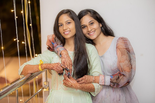 Two beautiful indian girls in ethnic clothes at wedding