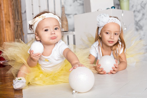 Two beautiful little girls. new Year