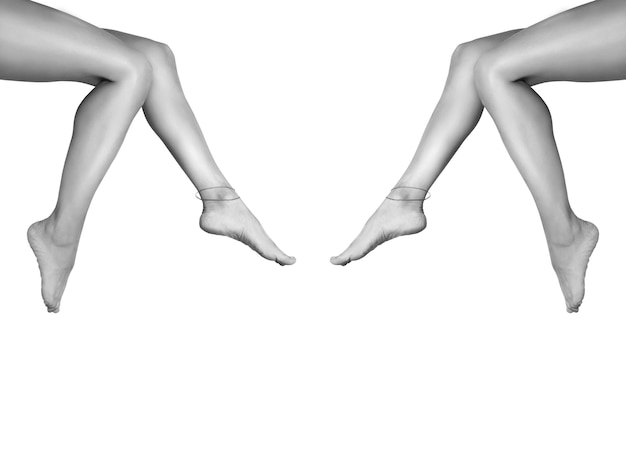 Two beautiful, smooth women's legs after laser hair removal. Treatment, technology concept