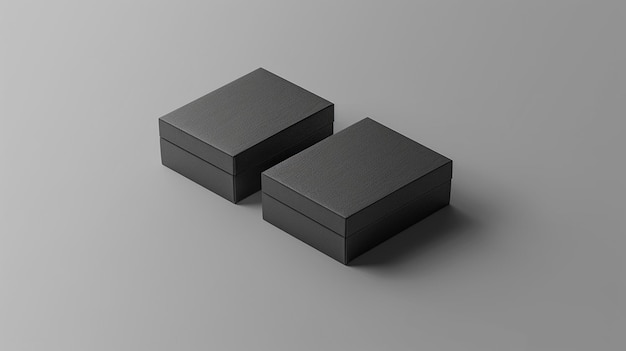 two black boxes are placed on a white surface