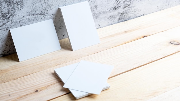 Two Black Business Cards Mockup standing near wooden stair