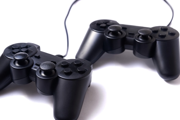 Two black joysticks on a white background