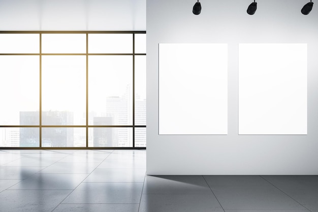 Two blank white posters with place for your logo or text on light wall in sunlit empty office with grey floor and city skyscrapers view from panoramic window 3D rendering mock up