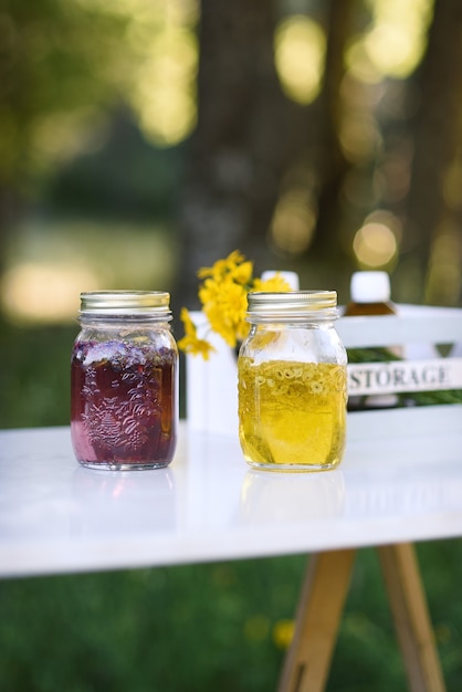 Two bottles of essential oil with flower extracts