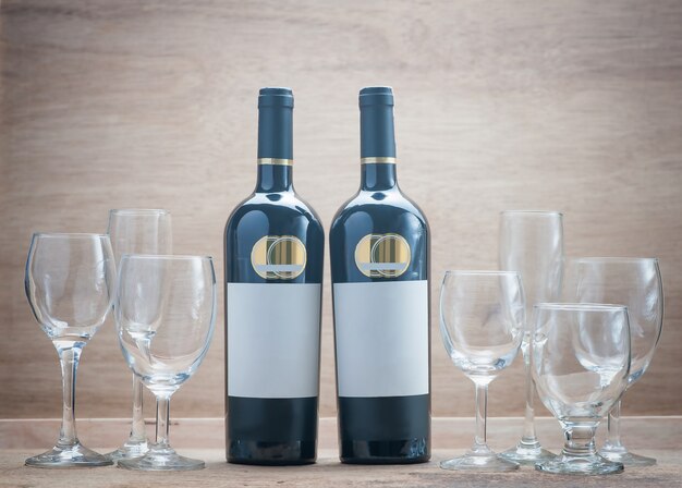 Two bottles wine and Set Clear Wineglass on wooden background with still life