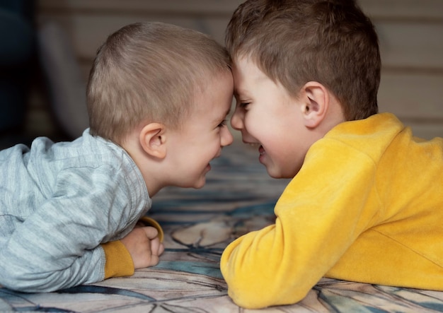 Two boys play and laugh