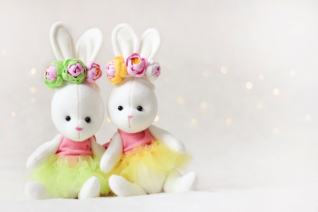 Two bright bunnies.Easter greeting card and toys for children.