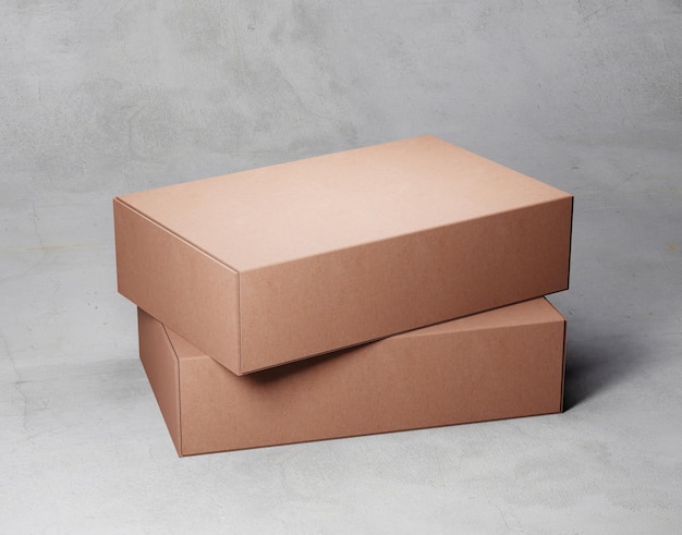 Two brown boxes are stacked on top of each other.