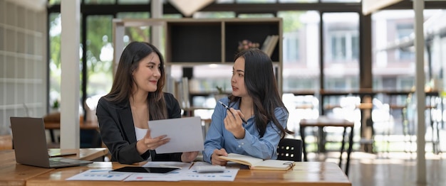 Two business colleague meeting to brainstorm the new project business strategy plan and analysis data document finance and accounting concept Briefing brainstorming consulting