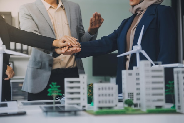 Photo two business executives elegantly attired in suits join hands in a gesture of unity solidarity and shared commitment towards a common goal or venture