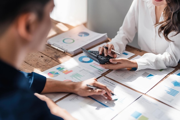 Two business people talk project strategy at office meeting room Businessman discuss project planning with colleague at modern workplace while having conversation and advice on financial data report