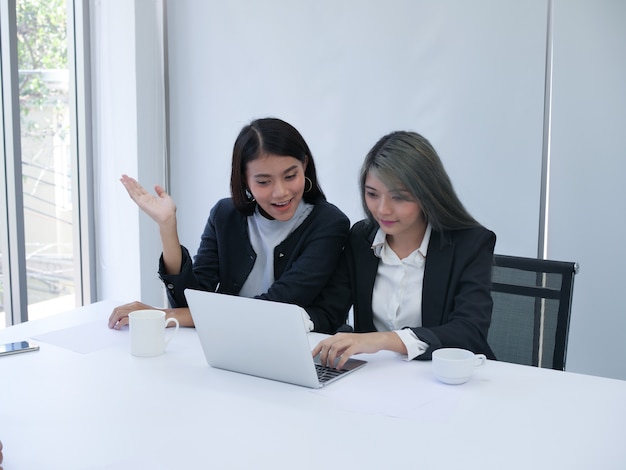 Two Business woman in meeting room.