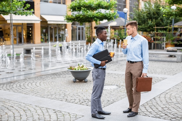 Two businessmen drinking coffee 