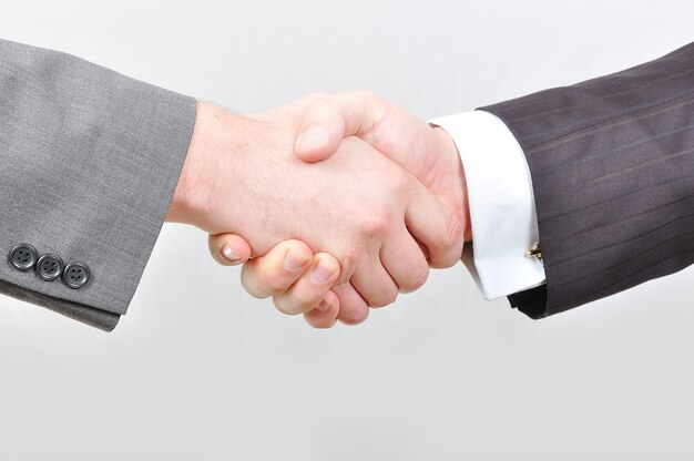 Two businessmen hands shaking