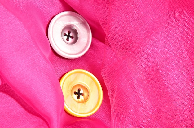 Two buttons on pink background