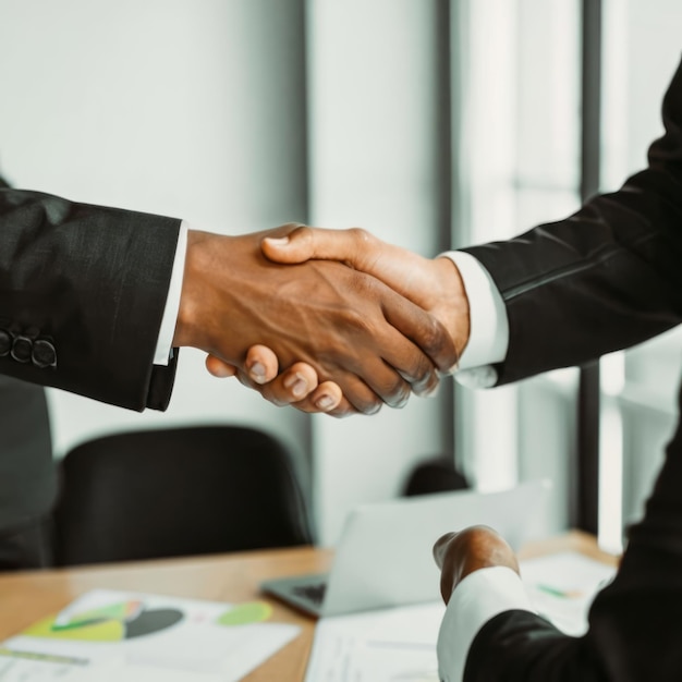 two confident business man shaking hands during a meeting in the office success dealing greeting