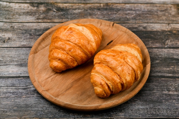 Two croissants. Fresh french croissant. Morning breakfast with a croissant. French breakfast. Great homey. Fresh tower.