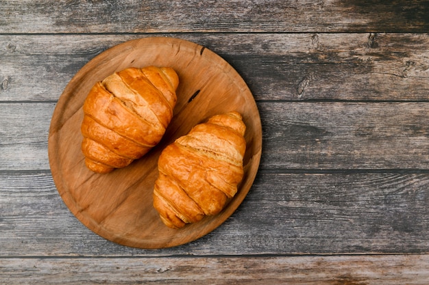 Two croissants. Fresh french croissant. Morning breakfast with a croissant. French breakfast. Great homey. Fresh tower.