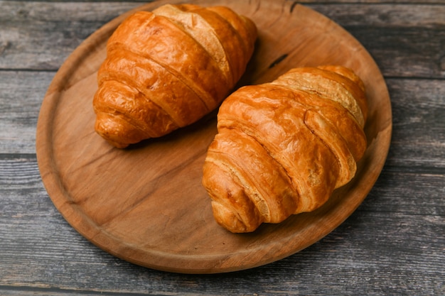 Two croissants. Fresh french croissant. Morning breakfast with a croissant. French breakfast. Great homey. Fresh tower.