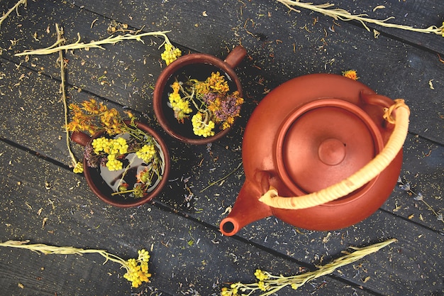 Photo two  cup of herbal tea herbal tea. dry herbs and flowers, herbal medicine.  flat lay.