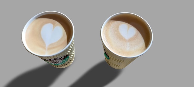 Two cups of coffee on a gray background