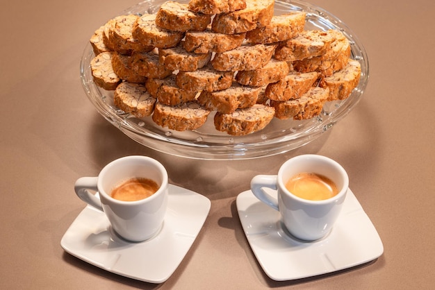 Two cups of espresso coffee and Cantucci biscuits traditional Italian almond cookies