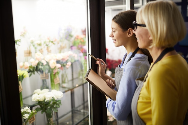 Two Female Florists Choosing Flowers