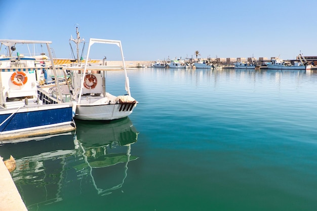 Two fishing boats docked in port