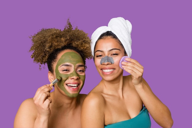 Two friends pamper themselves with facial treatments for a relaxing spa day at home with laughter and enjoyment Nourishing their skin for a glowing confident look