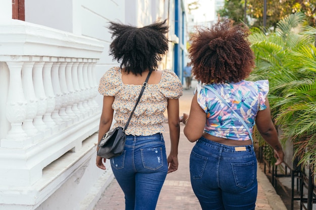 Two friends walking down the street