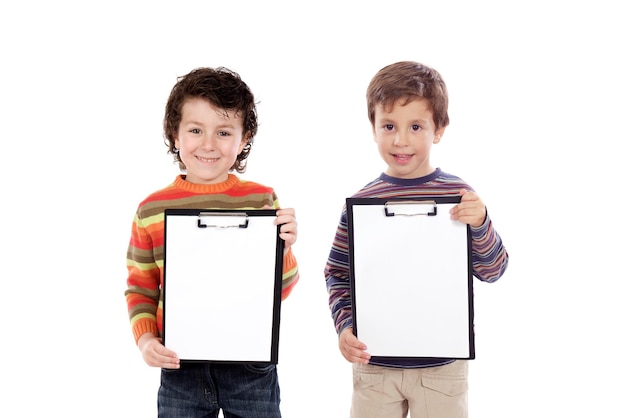 Two funny children holding clipboards isolated on a white background